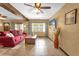 Living room with red couch and large windows at 132 N Hastings St, Orlando, FL 32835