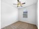 Bedroom with carpeted floor and ceiling fan at 6122 Dolostone Dr, Lakeland, FL 33811