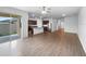 Open living room and kitchen with laminate floors at 6122 Dolostone Dr, Lakeland, FL 33811