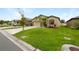 Attractive one-story house with a two-car garage and well-maintained lawn at 6122 Dolostone Dr, Lakeland, FL 33811