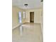 Bright living room featuring tile flooring and a glass door at 117 N Observatory Dr, Orlando, FL 32835