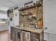 Home bar with granite countertop and mini fridge at 1890 Altavista Cir, Lakeland, FL 33810