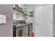 Laundry room with washer, dryer, and shelving at 1890 Altavista Cir, Lakeland, FL 33810