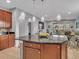 Large kitchen island with granite countertop and pendant lighting at 1890 Altavista Cir, Lakeland, FL 33810