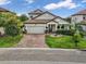 Two-story house with brick driveway at 1890 Altavista Cir, Lakeland, FL 33810