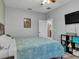 Main bedroom with a king-size bed and teal bedding at 1890 Altavista Cir, Lakeland, FL 33810