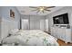 Main bedroom with king bed, large dresser, and en-suite bathroom at 1890 Altavista Cir, Lakeland, FL 33810