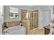 Spa-like bathroom with soaking tub and walk-in shower at 1890 Altavista Cir, Lakeland, FL 33810