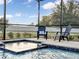 Relaxing spa with surrounding seating and a screened enclosure at 1890 Altavista Cir, Lakeland, FL 33810
