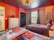 Themed bedroom with twin beds, Spider-Personal decor, and brick feature wall at 1471 Rolling Fairway Dr, Davenport, FL 33896