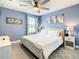 Spacious bedroom with a king-size bed and ceiling fan at 1471 Rolling Fairway Dr, Davenport, FL 33896