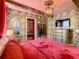 Magical bedroom with Hogwarts castle mural and red bedding at 1471 Rolling Fairway Dr, Davenport, FL 33896