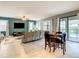 Spacious living room featuring a large TV and comfortable seating at 1471 Rolling Fairway Dr, Davenport, FL 33896