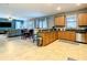 Island kitchen with stainless steel appliances and granite counters at 1471 Rolling Fairway Dr, Davenport, FL 33896