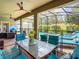 Outdoor patio with seating, dining area, and a view of the pool and spa at 1471 Rolling Fairway Dr, Davenport, FL 33896