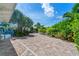 Brick paved driveway with tropical landscaping at 2903 Hill St, New Smyrna Beach, FL 32169