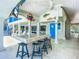 Covered patio with bar seating, ocean views, and a blue door at 2903 Hill St, New Smyrna Beach, FL 32169