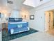 Bright main bedroom with blue bed frame and ocean-themed decor at 2903 Hill St, New Smyrna Beach, FL 32169