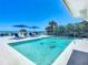 Relaxing pool with volleyball net, ocean view, and ample lounge space at 2903 Hill St, New Smyrna Beach, FL 32169
