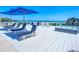 Spacious deck with lounge chairs, hot tub, and ocean views at 2903 Hill St, New Smyrna Beach, FL 32169
