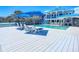 White wood deck with lounge chairs and ocean view by the pool at 2903 Hill St, New Smyrna Beach, FL 32169