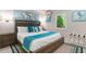 Relaxing bedroom with a king-size bed, coastal decor and window seat at 2903 Hill St, New Smyrna Beach, FL 32169