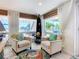 Cozy sitting area with ocean view and comfortable armchairs at 2903 Hill St, New Smyrna Beach, FL 32169