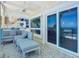 Covered balcony with ocean views and seating area at 2903 Hill St, New Smyrna Beach, FL 32169