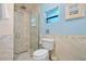 Clean bathroom featuring a walk-in shower and hexagon tile at 2903 Hill St, New Smyrna Beach, FL 32169