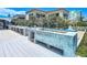 Outdoor kitchen features a built-in grill, bar seating, and a wood-fired oven at 2903 Hill St, New Smyrna Beach, FL 32169