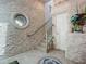 Modern entryway with stone wall, mosaic flooring and staircase at 2903 Hill St, New Smyrna Beach, FL 32169