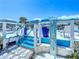Outdoor shower with blue tile and flip-flops for convenient beach access at 2903 Hill St, New Smyrna Beach, FL 32169