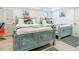 Guest bedroom with twin beds and coastal decor at 2903 Hill St, New Smyrna Beach, FL 32169