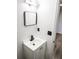 Clean bathroom with white vanity and black matte fixtures at 4814 Lake Shore Dr, Saint Cloud, FL 34772