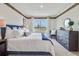 Bright bedroom with large window and dresser at 7163 Painted Bunting Way, St Cloud, FL 34773