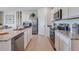 Modern kitchen with stainless steel appliances and granite countertops at 7163 Painted Bunting Way, St Cloud, FL 34773