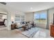 Spacious living room with large window and comfortable seating at 7163 Painted Bunting Way, St Cloud, FL 34773