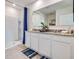 Double vanity bathroom with granite countertop and shower at 7163 Painted Bunting Way, St Cloud, FL 34773