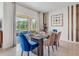 Bright dining area with glass table and seating for six at 7163 Painted Bunting Way, St Cloud, FL 34773