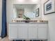 Bathroom with double vanity and large mirror at 7163 Painted Bunting Way, St Cloud, FL 34773