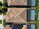 Aerial view of houses and community amenities, including pools and golf course at 1410 Wexford Way, Davenport, FL 33896