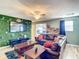 Gathering-friendly game room with large TV and comfy seating at 1410 Wexford Way, Davenport, FL 33896