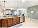 Modern kitchen with stainless steel appliances and granite countertops at 1410 Wexford Way, Davenport, FL 33896