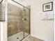 Large walk-in shower with glass enclosure and tile surround at 1410 Wexford Way, Davenport, FL 33896