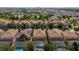 Community view showcasing multiple homes with pools and solar panels at 1410 Wexford Way, Davenport, FL 33896