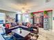 Fun game room with a large sectional sofa and Jurassic Park theme at 1410 Wexford Way, Davenport, FL 33896
