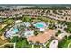 Aerial view showing resort-style pools, clubhouse, and community at 1410 Wexford Way, Davenport, FL 33896