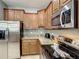 Modern kitchen with stainless steel appliances and granite countertops at 1410 Wexford Way, Davenport, FL 33896