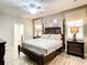 Spacious Primary bedroom with king-size bed and ensuite bathroom at 1410 Wexford Way, Davenport, FL 33896