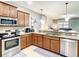 Modern kitchen with stainless steel appliances and granite countertops at 1410 Wexford Way, Davenport, FL 33896